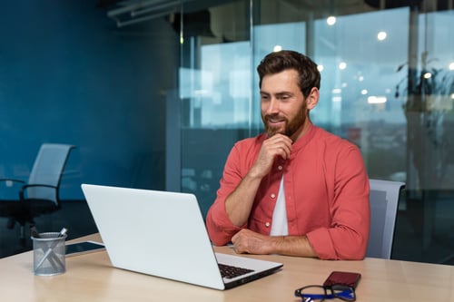 Man looking at laptop screen