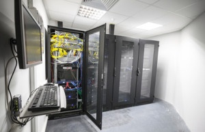 Modern server room interior with black computer cabinets and use
