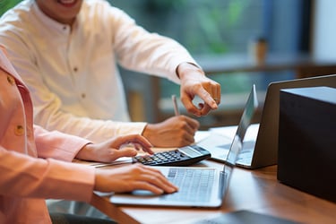 businesspeople-hand-pointing-at-laptop-computer-to-2023-11-27-04-51-32-utc-1
